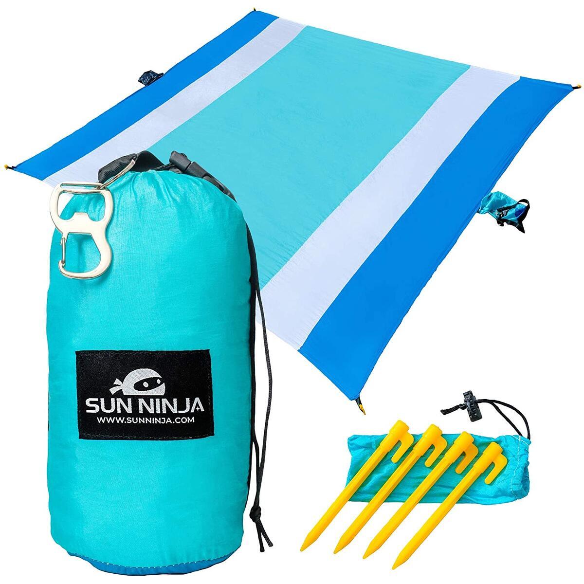 SUN NINJA Sand Free Beach Blanket - Outdoor Blanket, Beach Mat & Accessories - 10ft X 9ft Lightweight Blanket with Storage, Bottle Opener, Carabiner, Shoulder Strap, Corner Sand Pockets & 4 Stakes - Orange or Blue